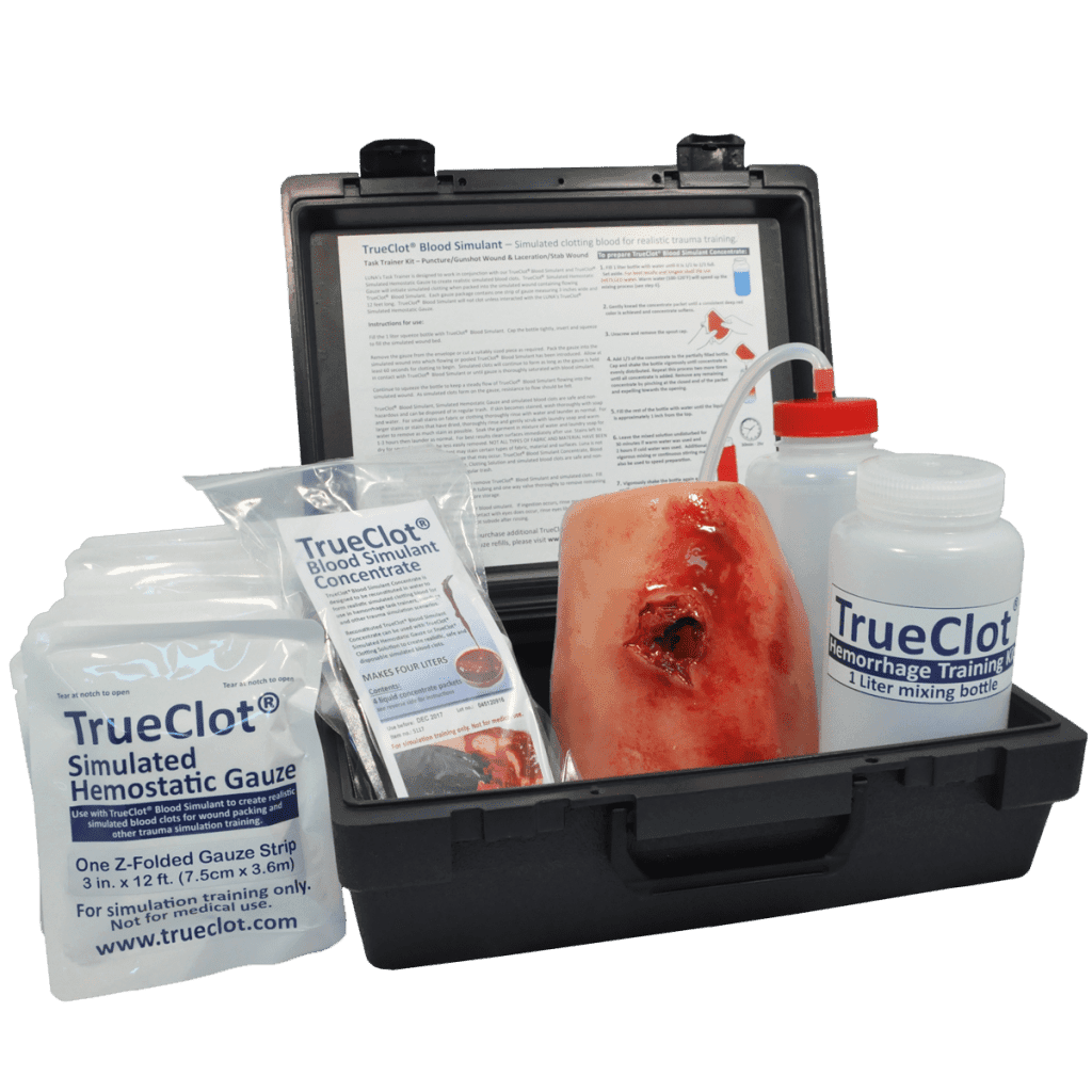 True Clot Hemorrhage Training Kit: Includes black case, TrueClot Simulated Hemostatic Gauze, Blood Simulant Concentrate, mixing bottle, wound limb model, and instructional sheet for precise hemorrhage training.