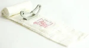 4" Emergency Trauma Bandage (ETB) - Civilian Version: White fabric roll with integrated plastic clamp and red instructional diagram. Optimized for immediate first aid application.