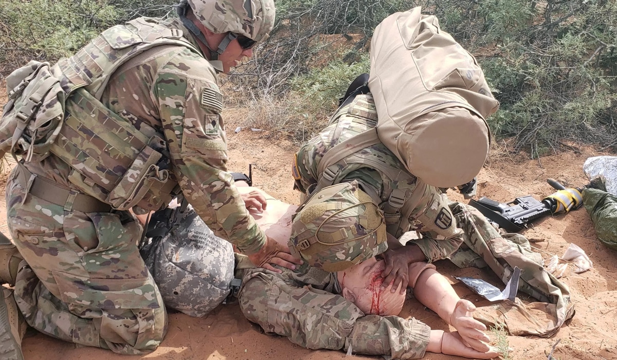 CPR training for two soldiers on a dummy