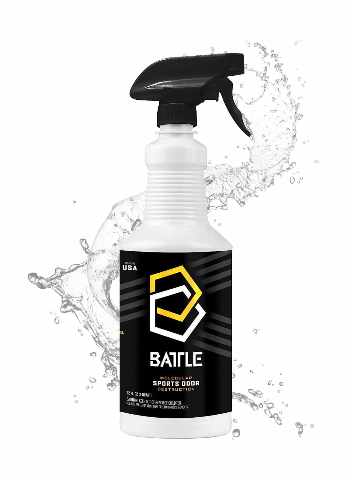 32oz white spray bottle labeled "Battle Odor Eliminator" with black trigger nozzle; backdrop: liquid splash.