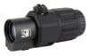 Image depicts a black EOTECH G33 3X MAGNIFIER NM optic. Features include adjustable dial, QR code, serial number on side, and durable textured body.